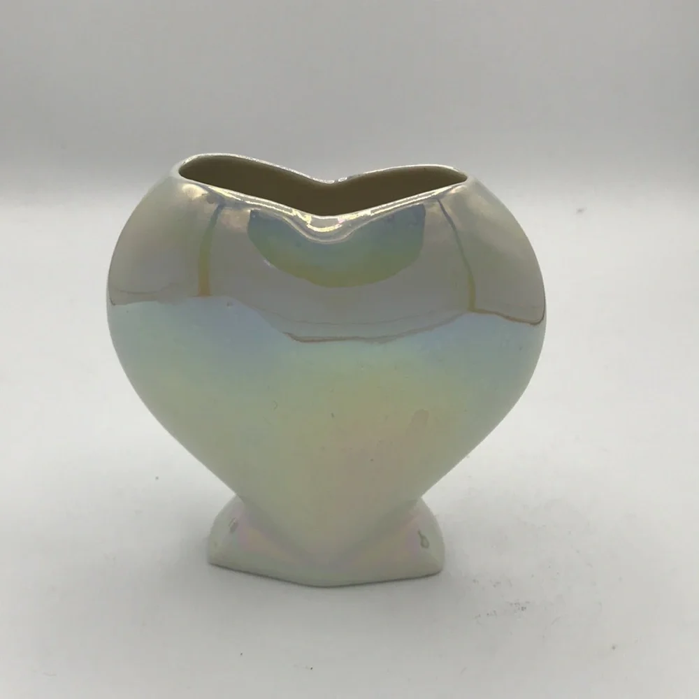 Iridescent heart-shaped vase with purple flower design